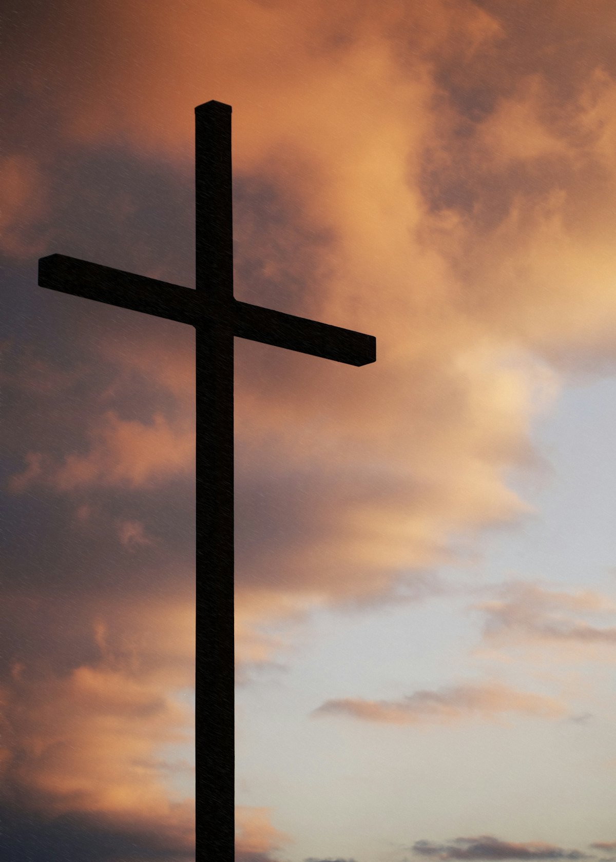 Silhouette of a cross at sunrise